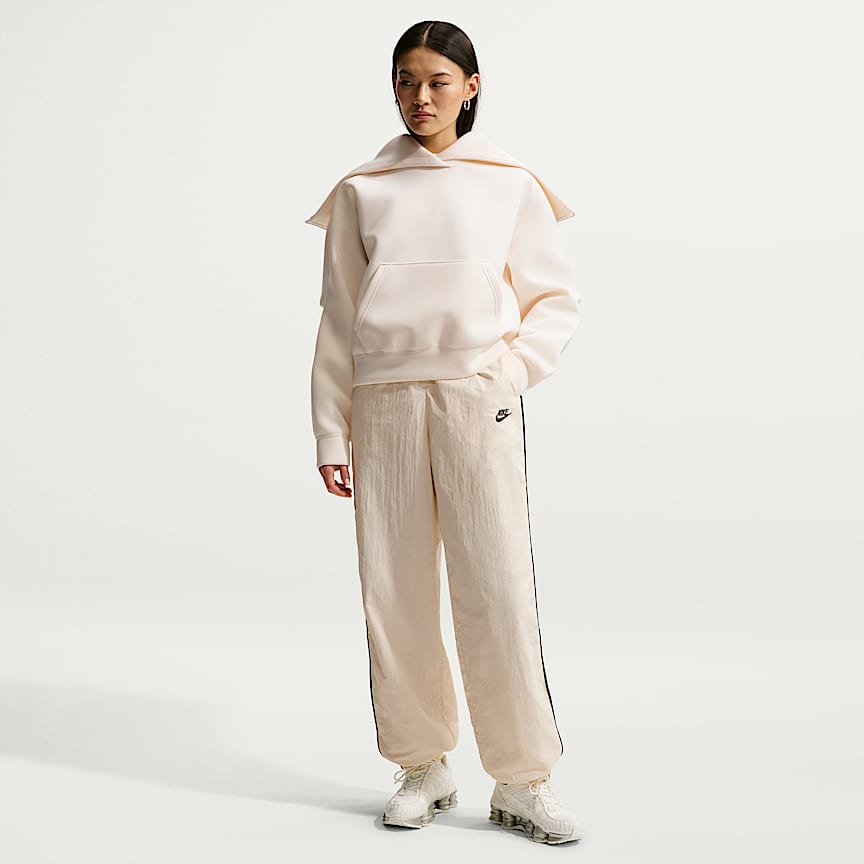 Nike Sportswear Windrunner Women's Mid-Rise Slim Knit Pants. Nike.com